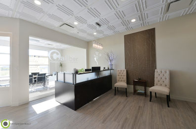 commercial renovation features vinyl plank flooring and suspended ceilings