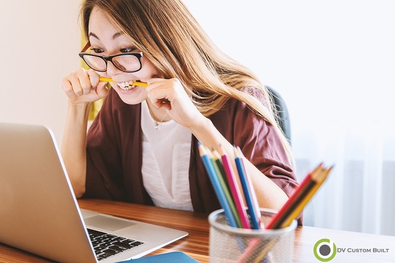 lady is nervously googling for a renovation contractor on the computer is pictured.